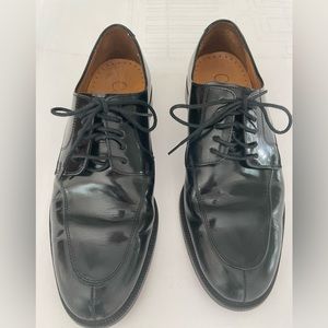 Cole Haan black leather lace up shoes.